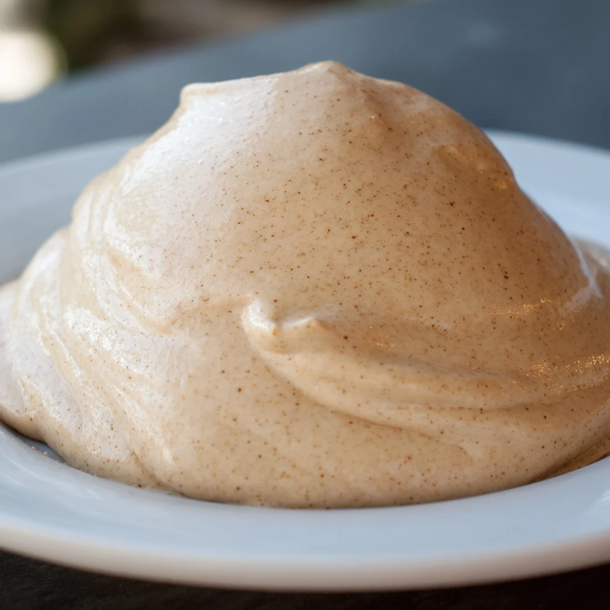 Rich gingerbread frosting with sugar, topped with cinnamon sugar on frosted holiday cupcakes.