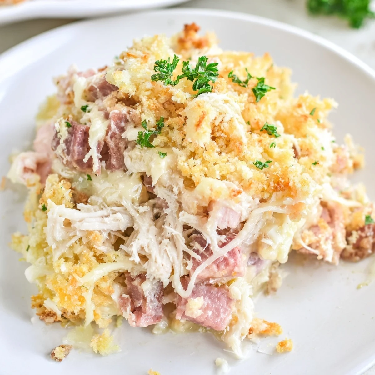 Golden brown Chicken Cordon Bleu Casserole fresh from the oven with melted Swiss cheese and bubbly edges.