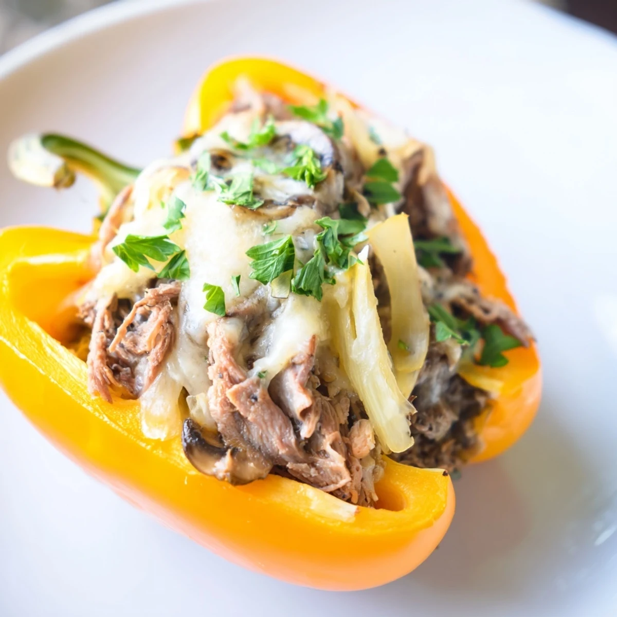 Sizzling beef and onions stuffed into peppers, finished with bubbly provolone cheese for a satisfying main dish.