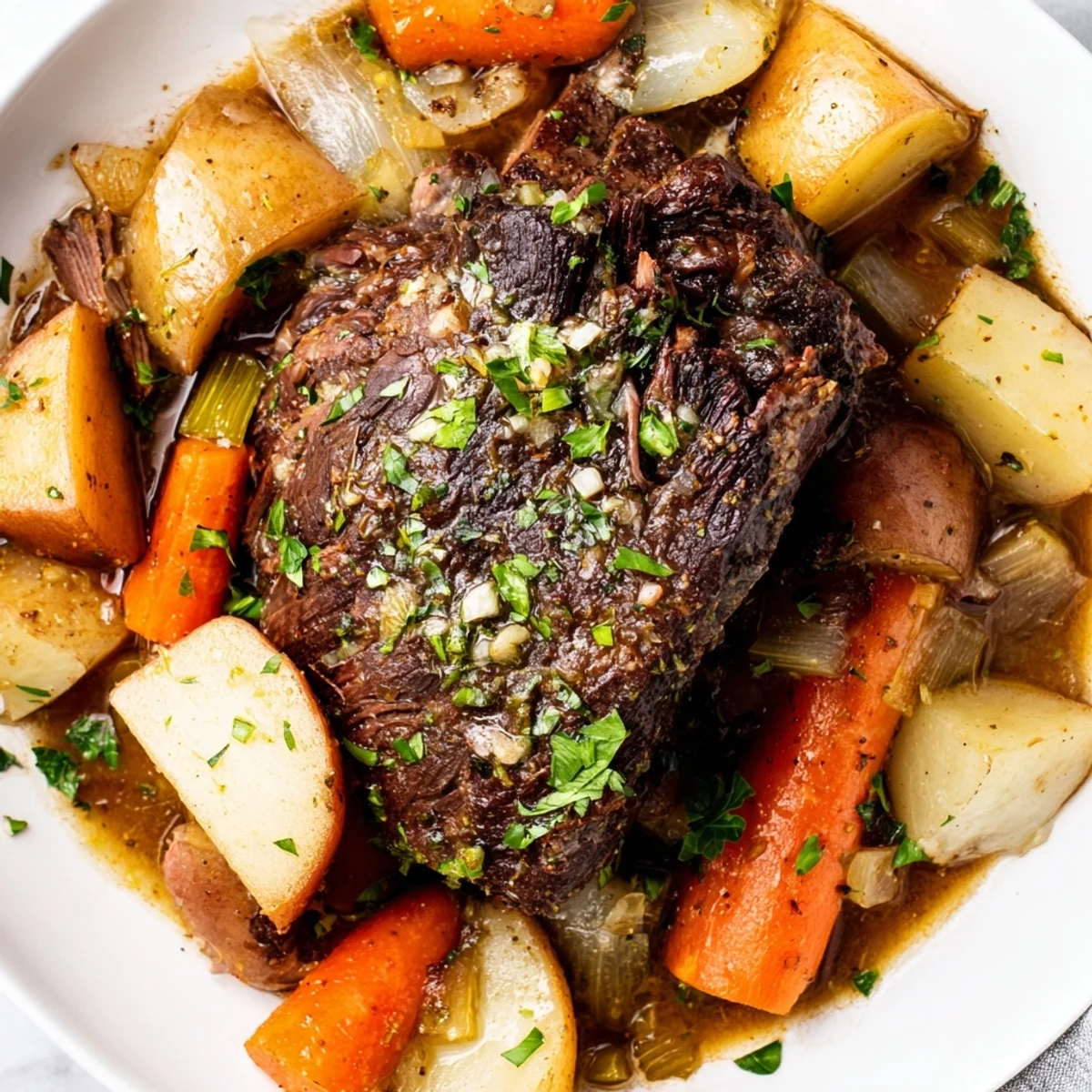 Fork-tender Slow Cooker Beef Pot Roast with Root Veggies surrounded by carrots, potatoes, and parsnips in rich broth.