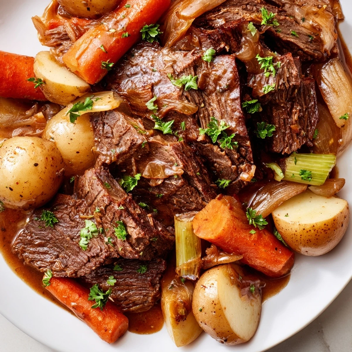 Family style platter featuring Slow Cooker Beef Pot Roast with Root Veggies, served with rustic bread to mop up the hearty juices and a sprinkle of parsley.