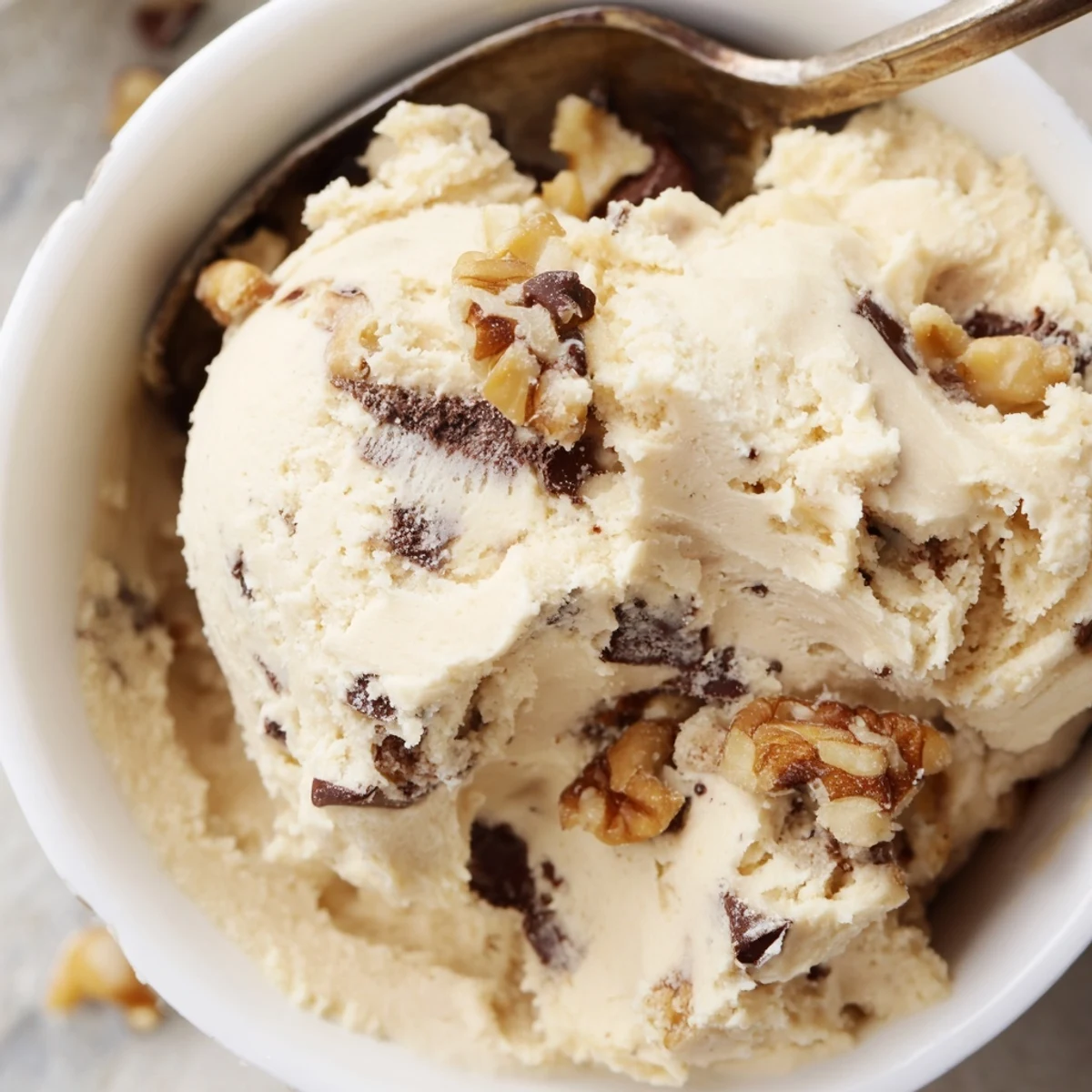 Close-up of Guilt Free Greek Yogurt Cookie Dough with peanut butter swirl, honey drizzle, and a sprinkle of sea salt.