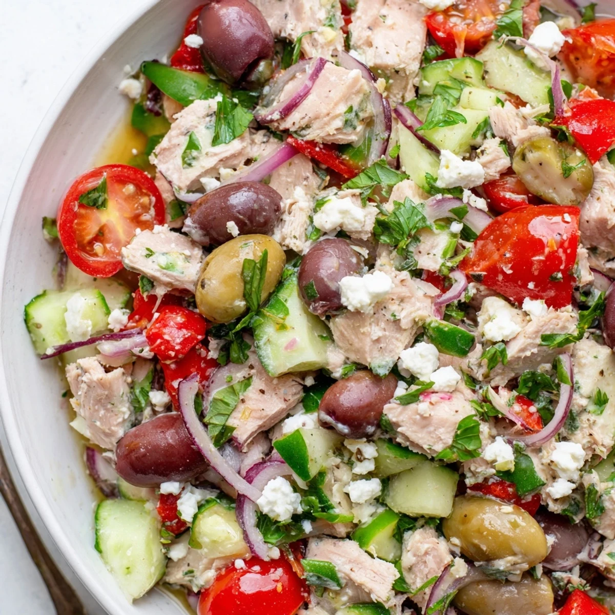Fresh Mediterranean tuna salad featuring flaky tuna, crisp vegetables, and tangy lemon vinaigrette