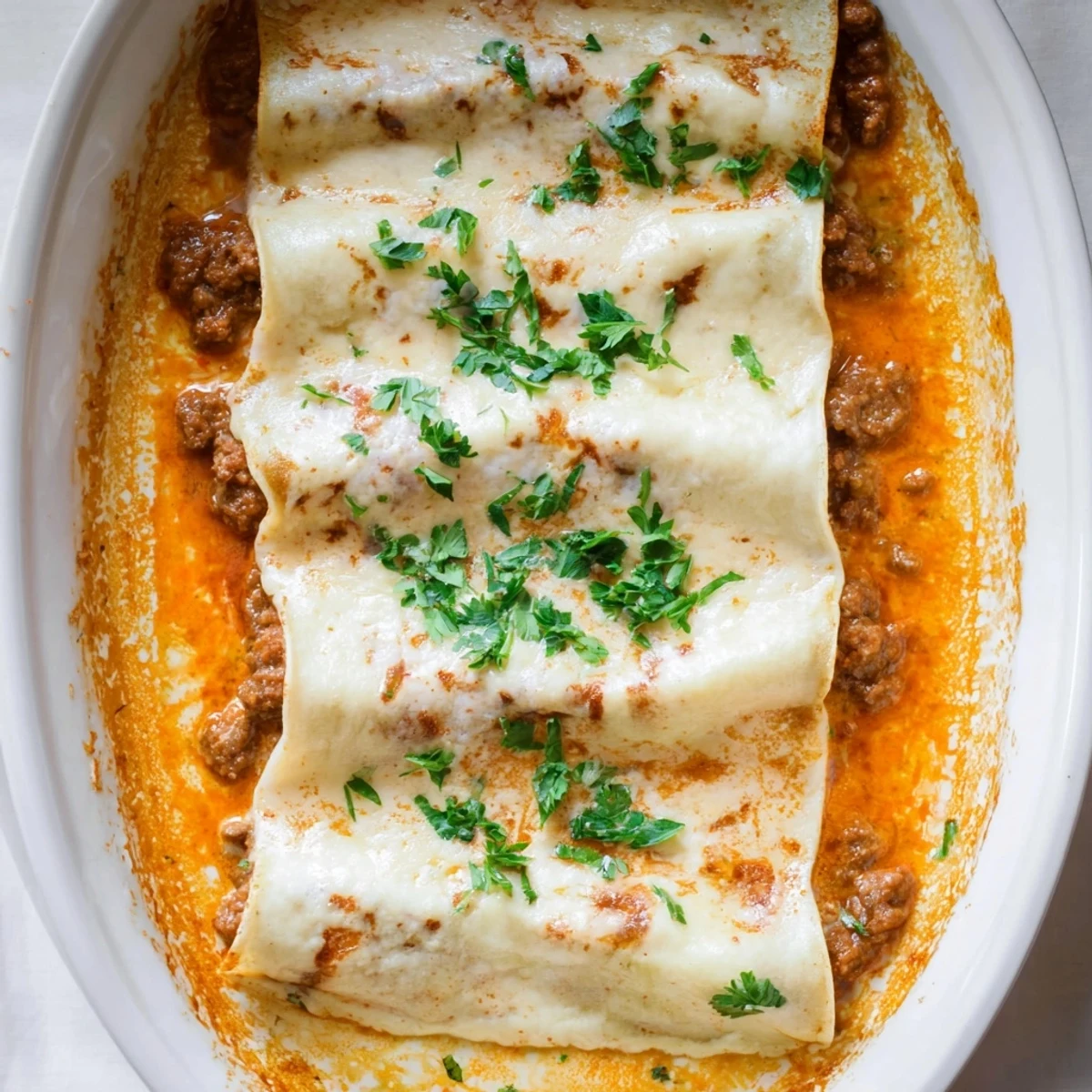 Savory Hortobágyi palacsinta filled with paprika ground veal baked until golden and bubbly