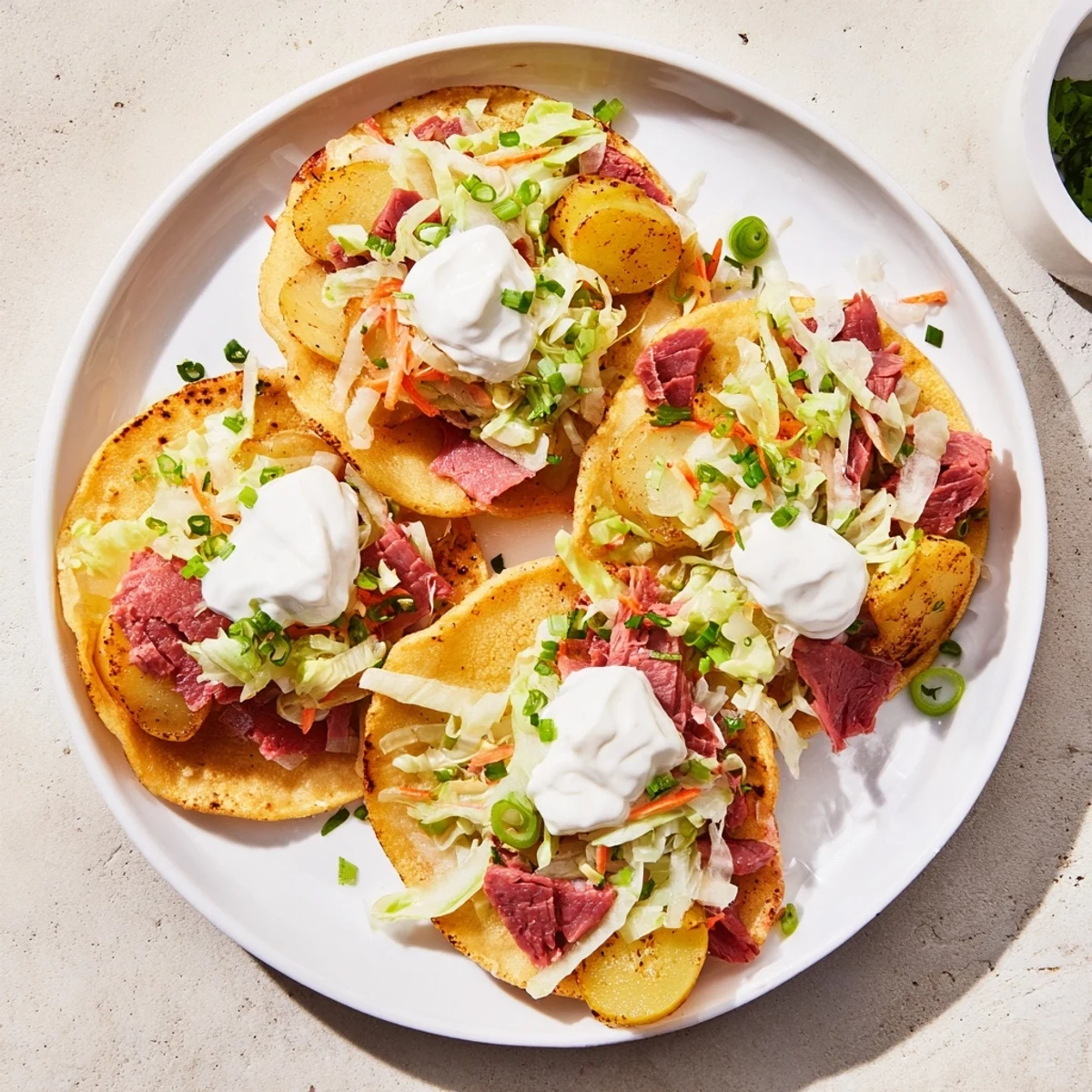 Homemade Irish tacos showcasing shredded beef, roasted potatoes, and fresh vegetable slaw