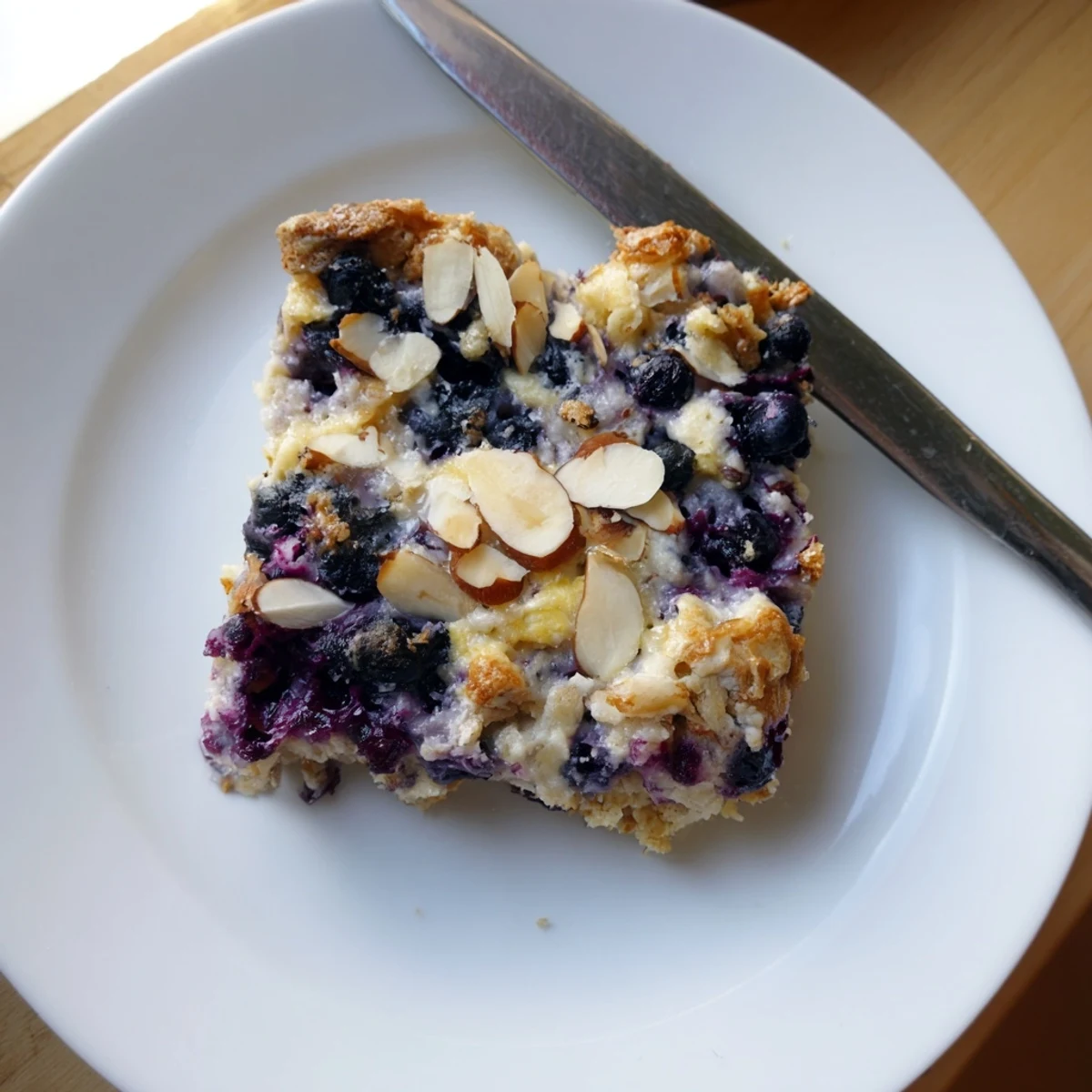 Golden blueberry cottage cheese breakfast bake with juicy berries and oat crumble topping