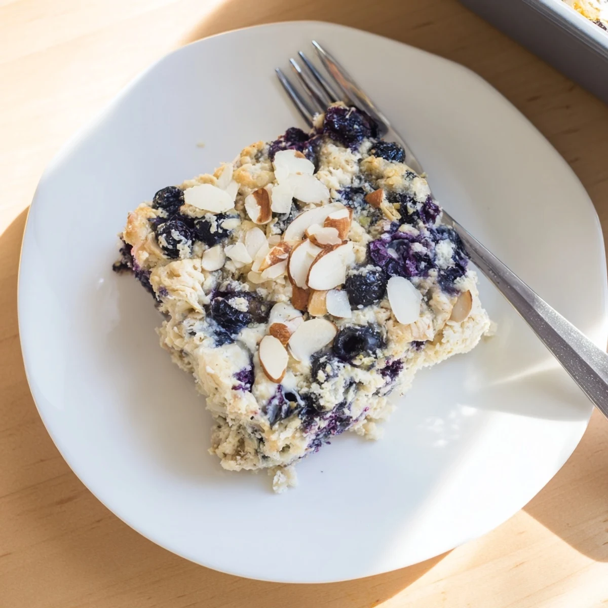 Baked blueberry cottage cheese breakfast bake casserole with golden brown oat topping