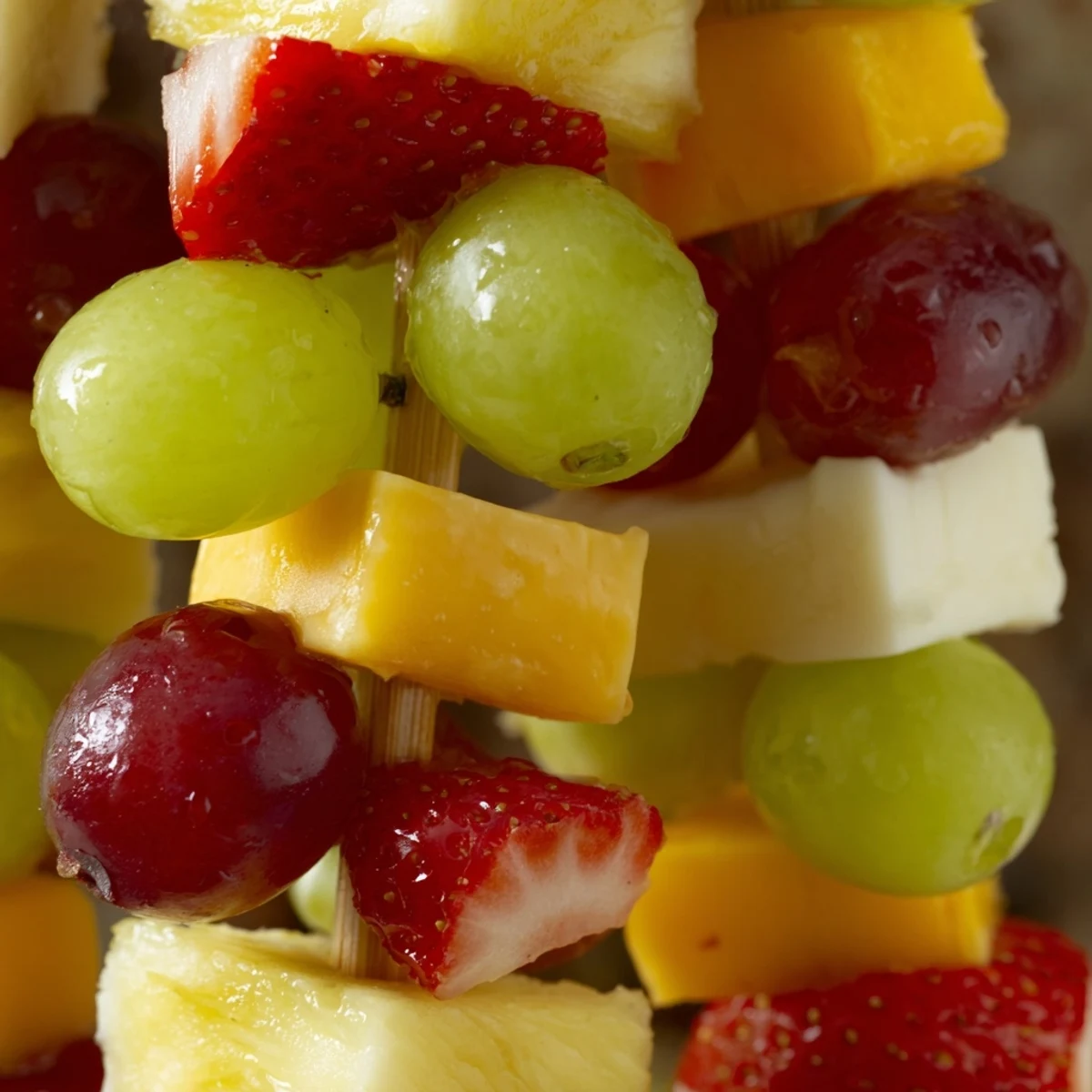Fresh fruit and cheese kabobs featuring alternating cubes of creamy Monterey Jack and juicy grapes
