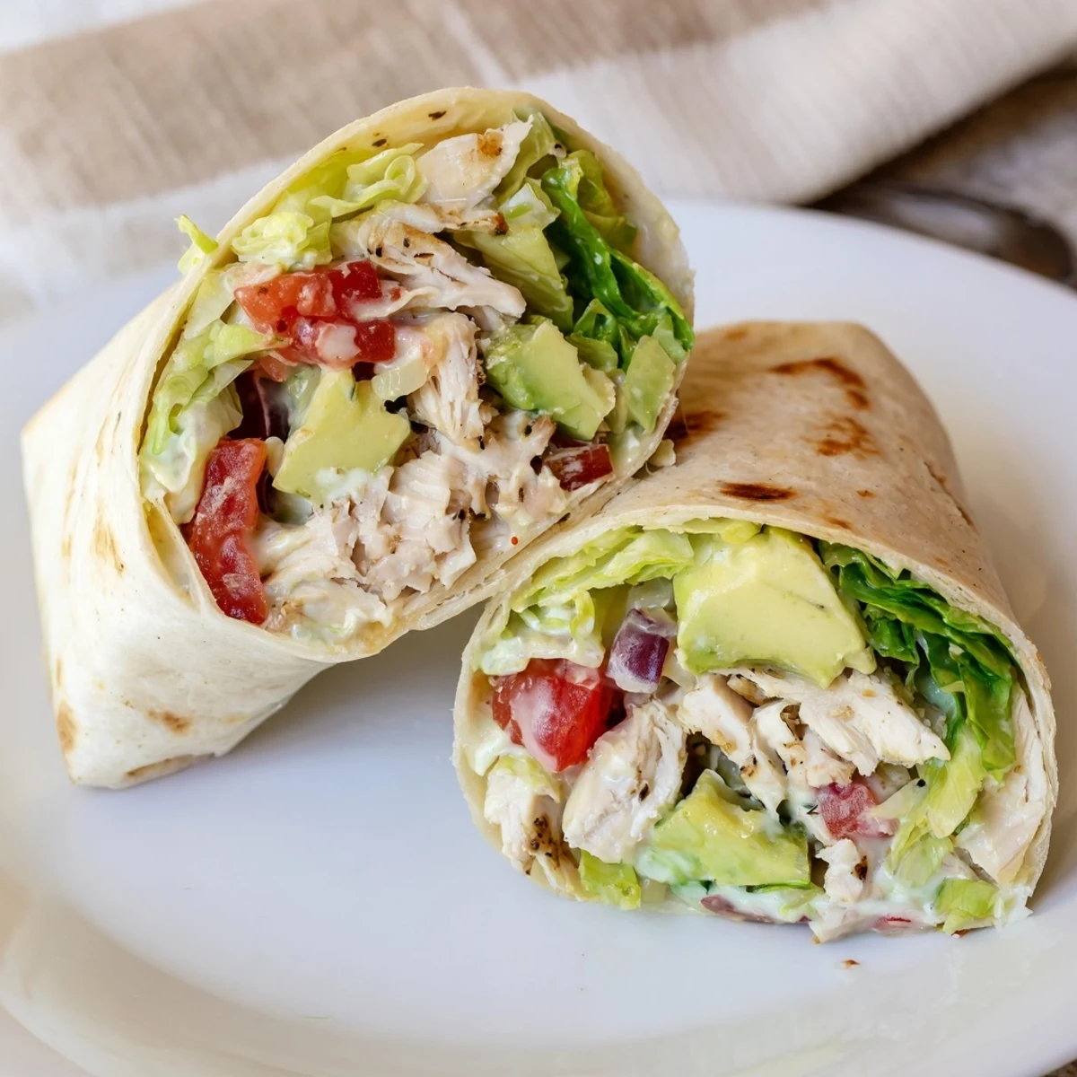 Warm Chicken Avocado Ranch Burritos with shredded chicken, ripe avocado and zesty dressing