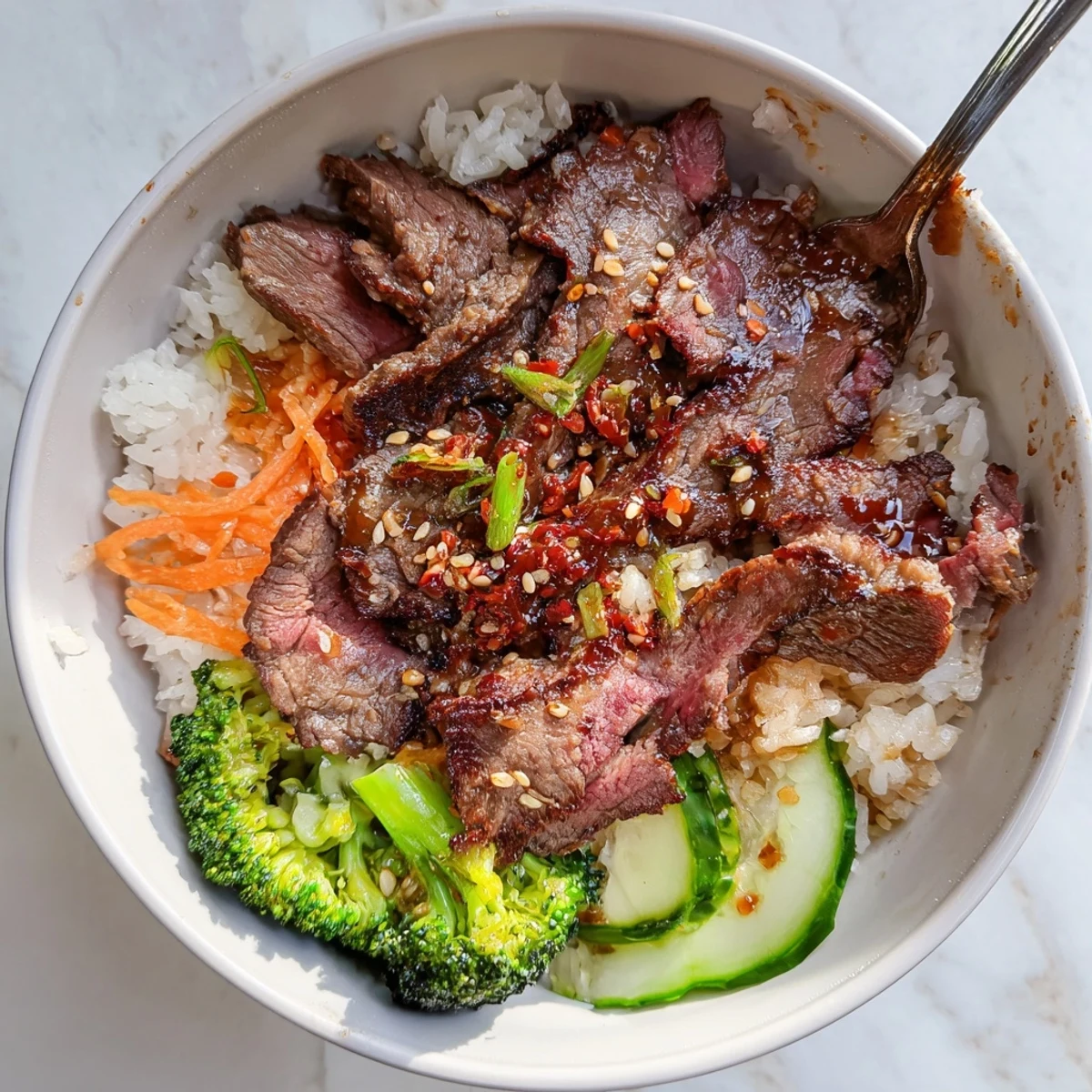 Served hot, the Savory Char Siu Beef Rice Bowl contrasts crunchy cucumber, sesame