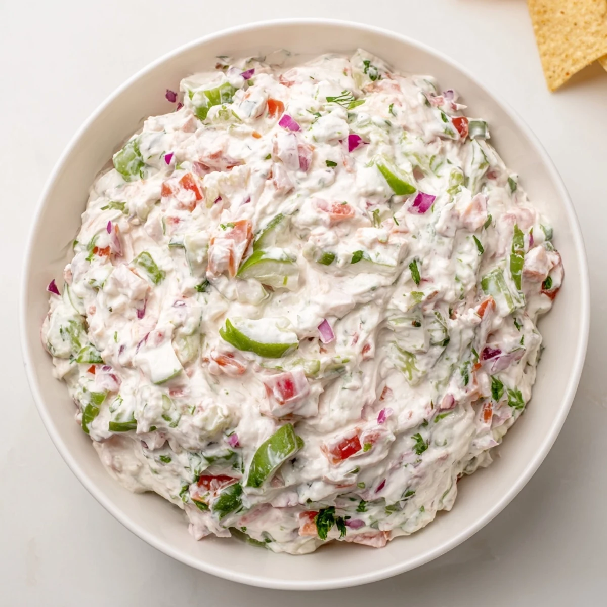 Vibrant bowl of chunky Grillos Pickle De Gallo Ranch Dip garnished with green onions and cilantro, ready for party dipping