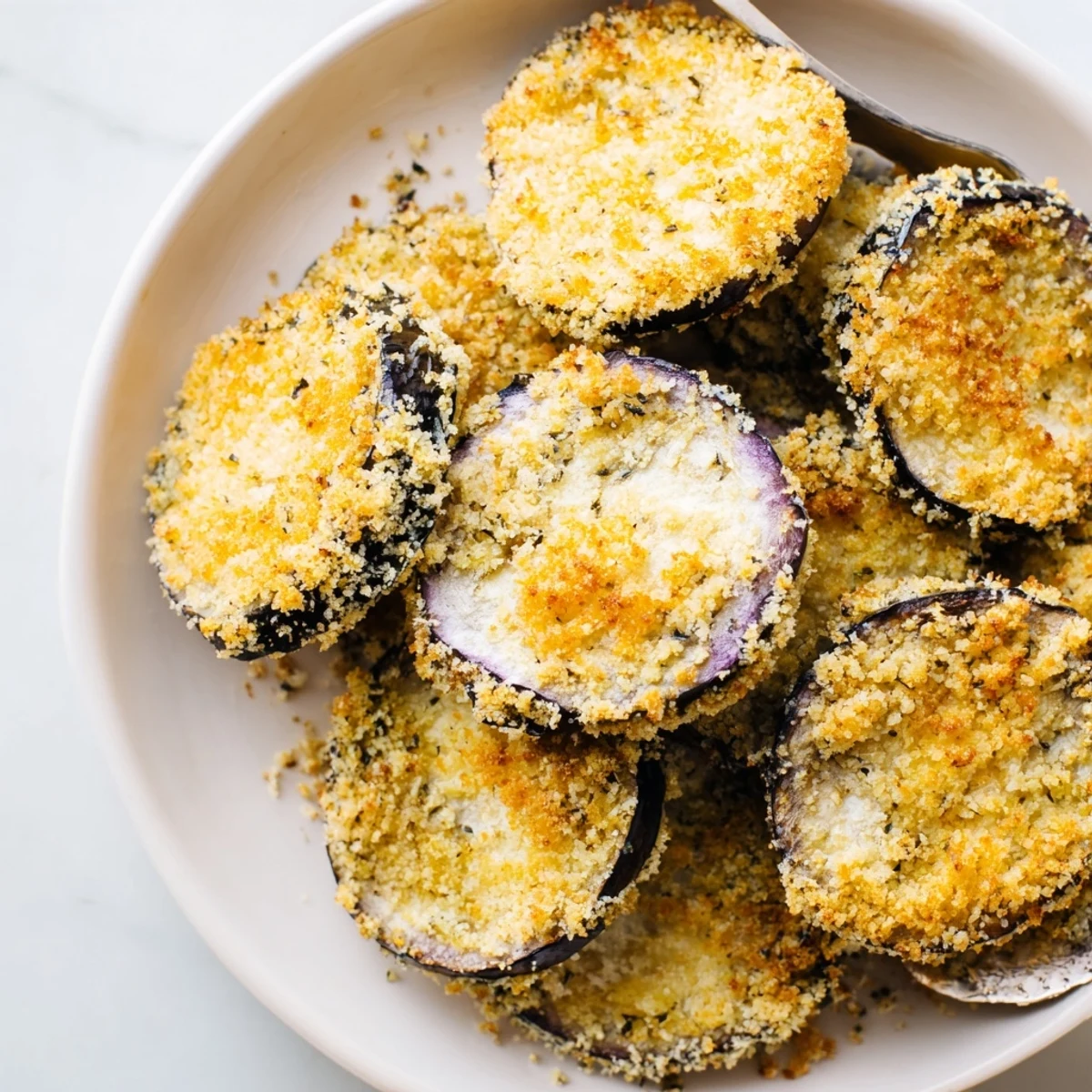Crispy Baked Eggplant slices golden and crunchy, served with marinara dipping sauce