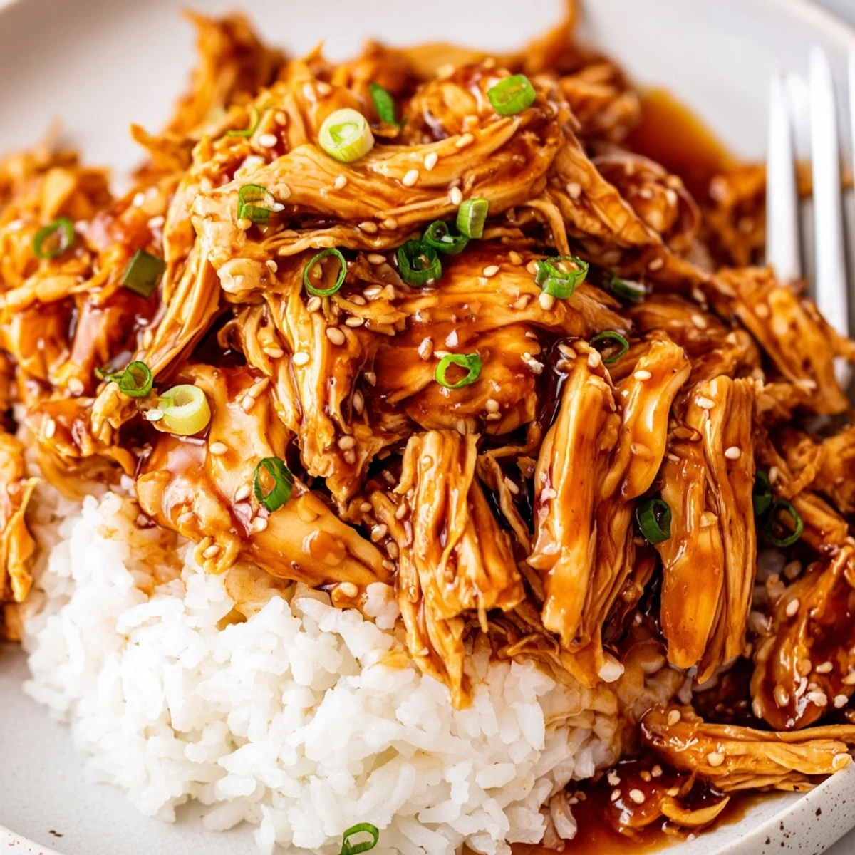 Crockpot Honey Garlic Chicken tender, slow-cooked aroma filling kitchen, served with quinoa