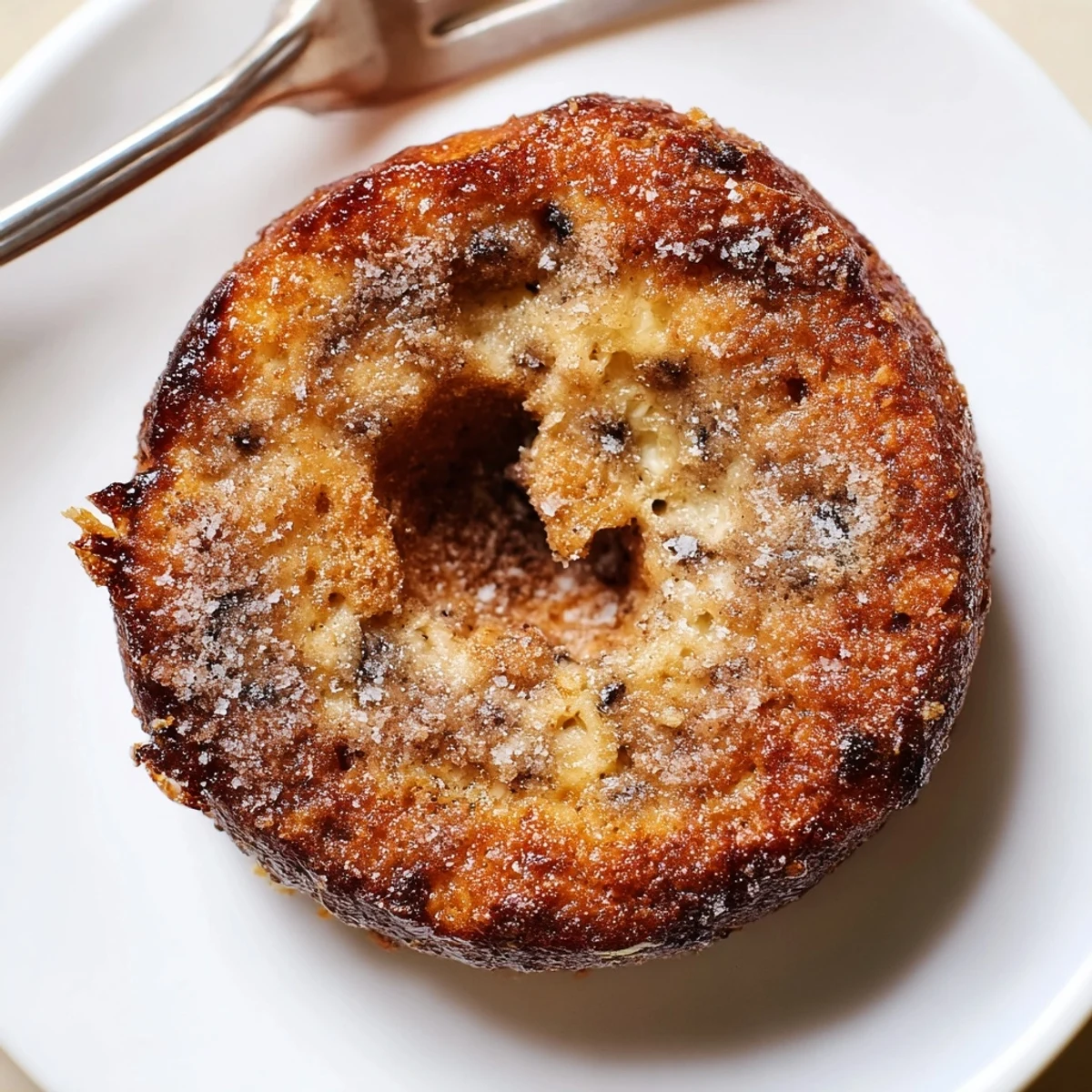 Warm Banana Donuts on a wire rack, cinnamon dusting and soft crumb