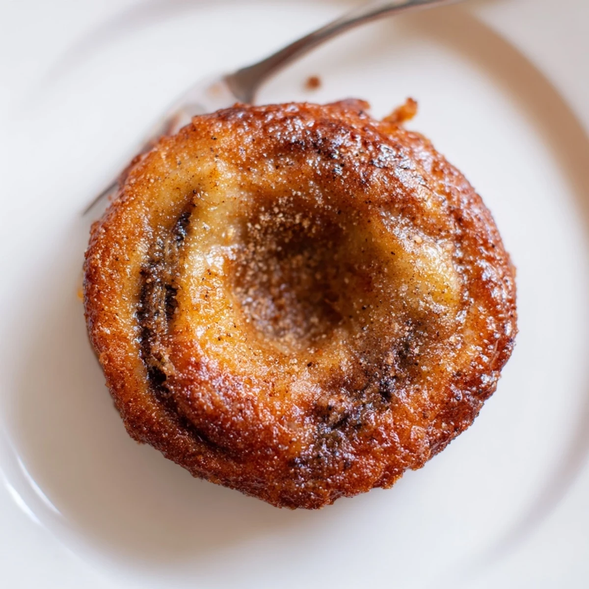 Breakfast Banana Donuts stacked on plate, powdered sugar, moist banana aroma