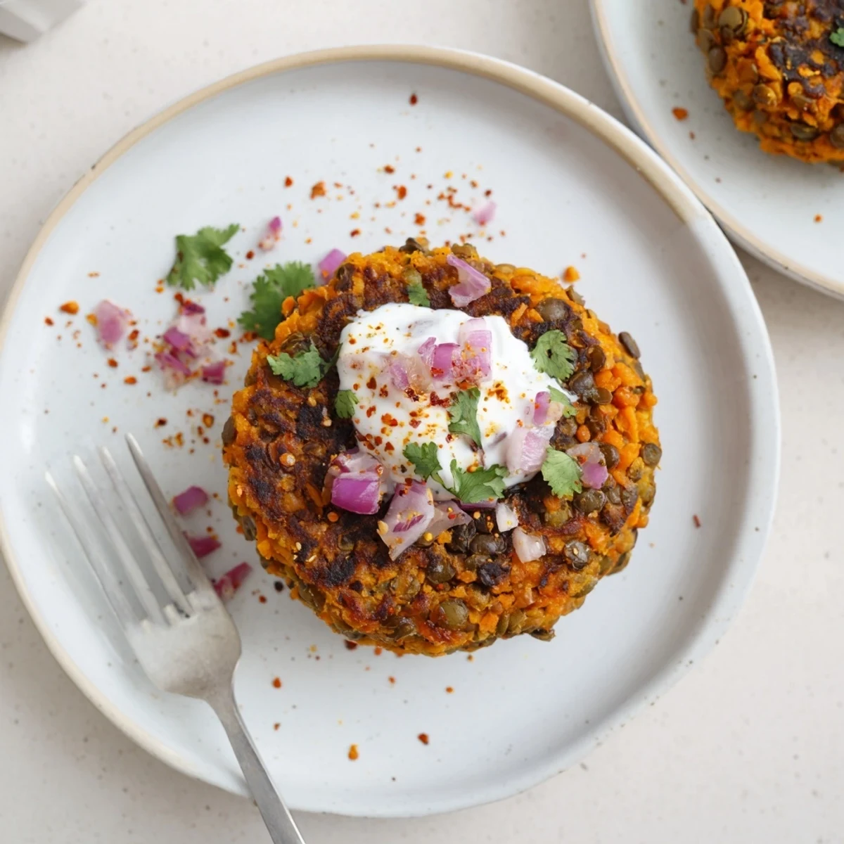 Skillet-sizzling Crispy Sweet Potato Lentil Patties with fragrant cilantro and pepper flakes.  
