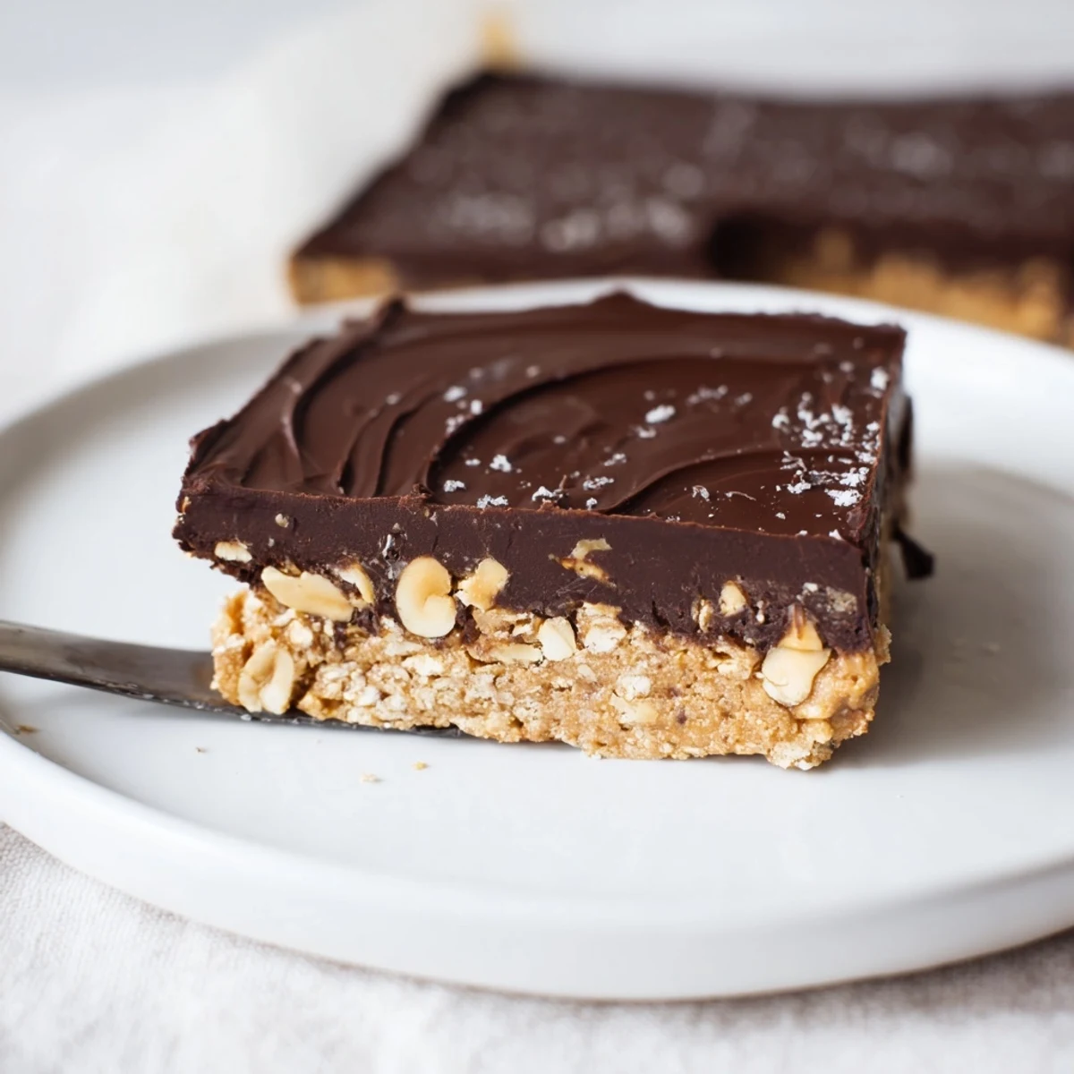 Tray of Peanut Butter Bars cut into squares, rich, nutty, perfect with milk
