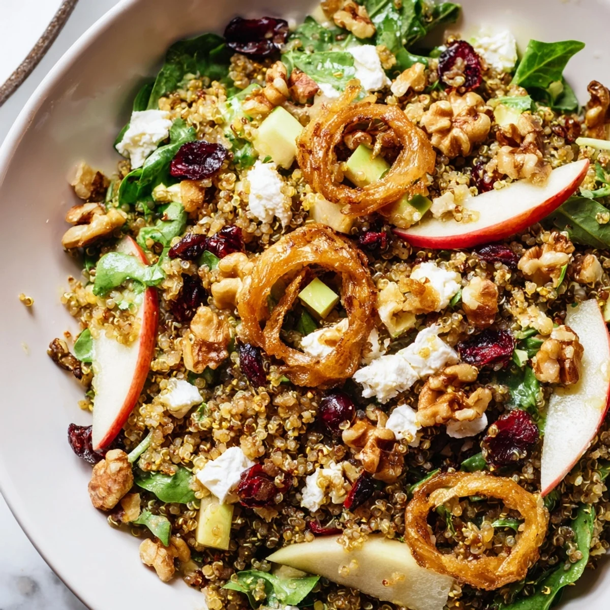 Crispy shallots crown this vibrant Honey Mustard Quinoa Apple Salad brimming with fresh greens