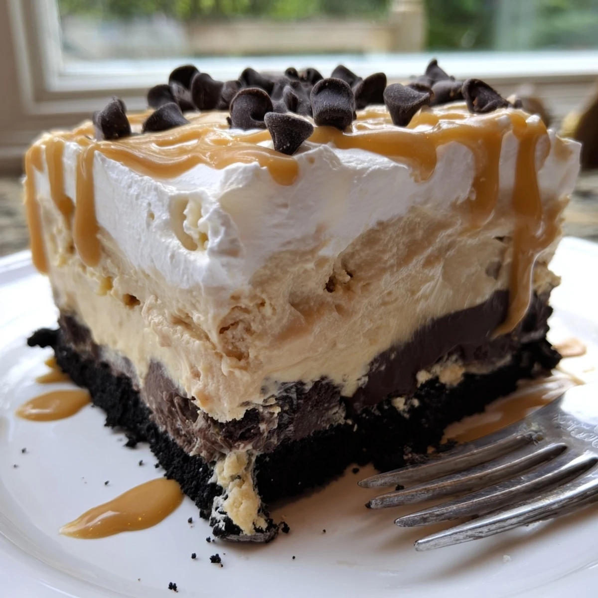 Creamy peanut butter layered delight with rich chocolate pudding on a cookie crust