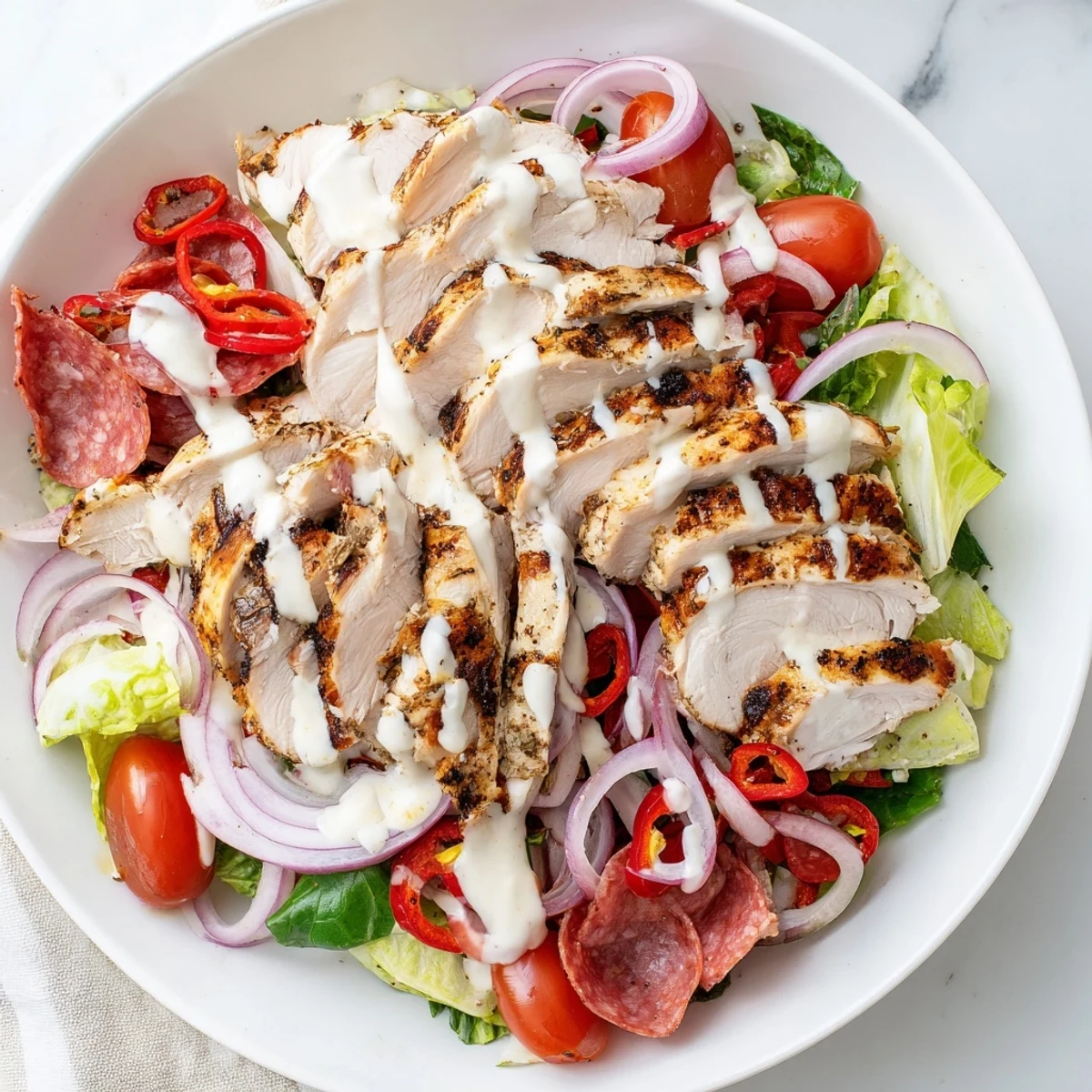 Hearty Italian Grinder Chicken Salad loaded with deli meats and tangy dressing
