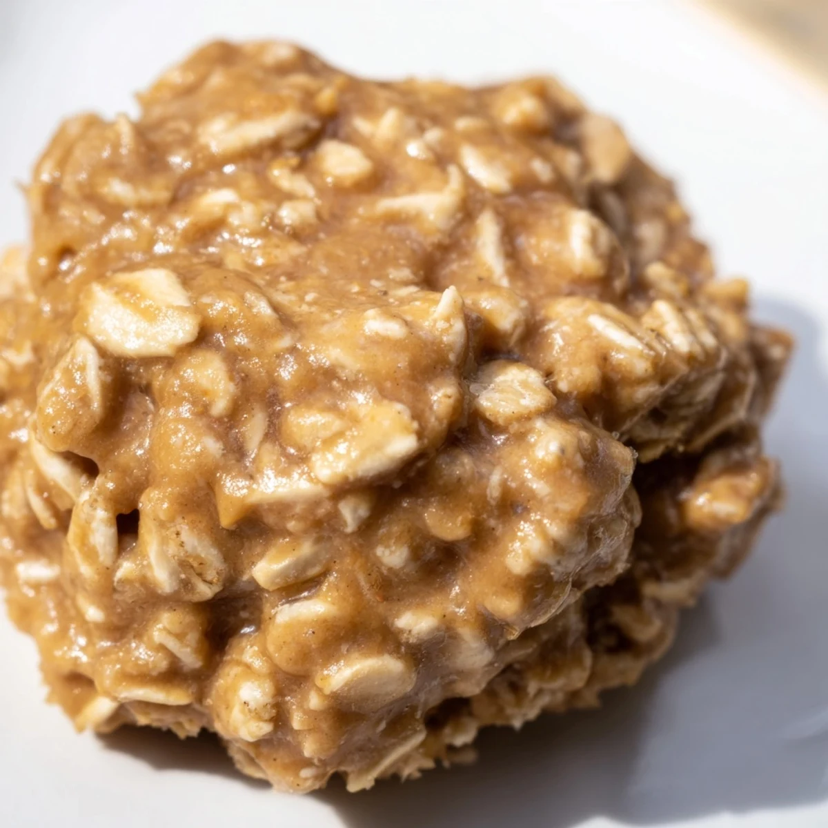 Rich, chewy peanut butter no bake cookies on a cooling rack.  