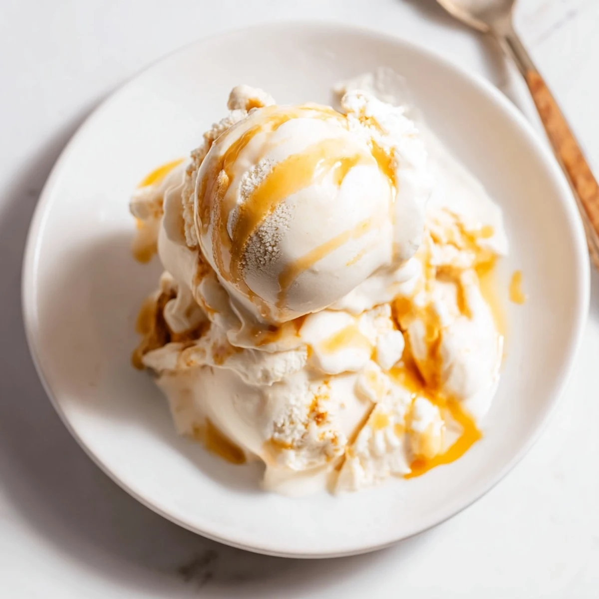 Creamy no churn salted caramel ice cream swirled with rich golden caramel sauce.  