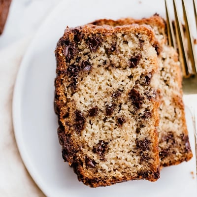Golden one bowl banana bread with melted chocolate chips fresh from the oven  